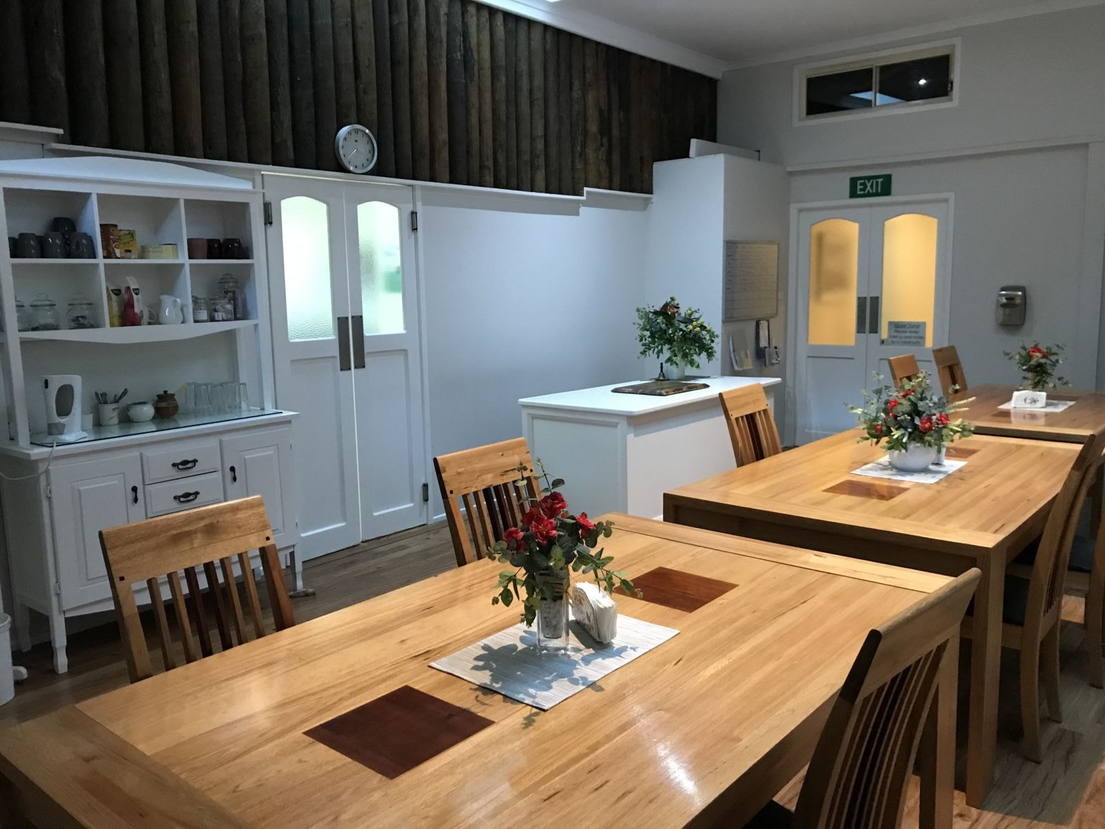 The shared dining room set for a meal