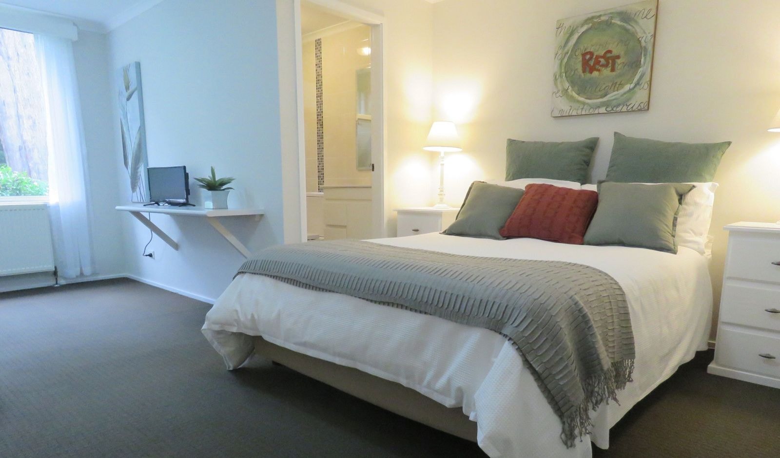 A deluxe queen guest room with garden outlook